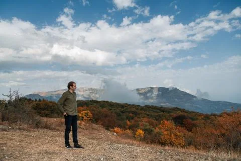 Man walking in the mountains Stock Photos