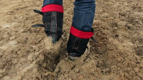 A man walking in the mud. Stock Footage 231165850
