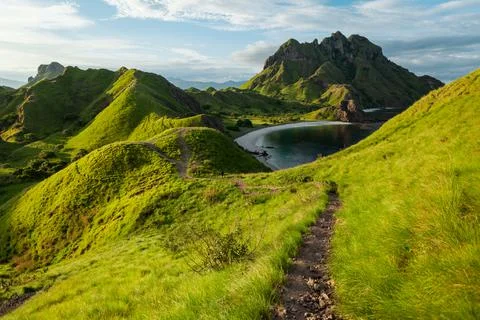 A man is walking on the narrow path on Padar island Stock Photos