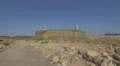 Man walking near the Fort of São Francisco Xavier, Porto 4k or 4k+ Resolution