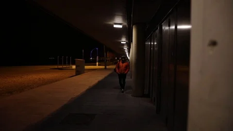 Man walking at night in the city Stock Footage 104123441