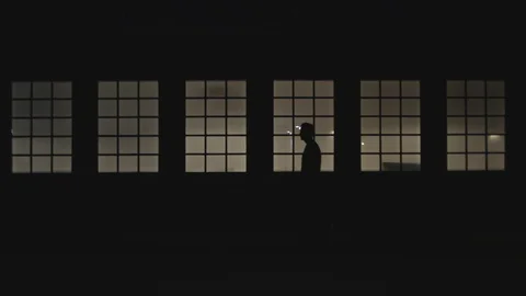 Man walking at night Stock Footage 129711069