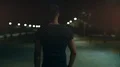 The man walking in the night park. slow motion 4k or 4k+ Resolution