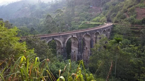 Man walking on the Nine Arch Bridge. Ella, Sri Lanka Stock Footage 155649127
