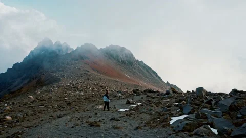 man walking on the north face of pico de... | Stock Video | Pond5
