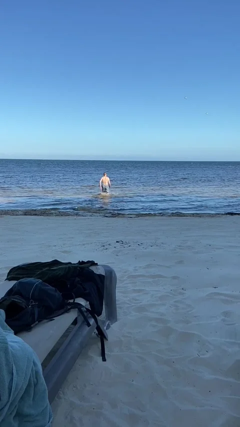 Man Walking in Ocean Stock Footage 244427352