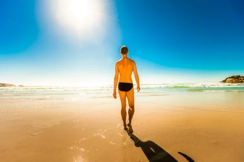 Man walking into the ocean Фото