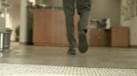 Man Walking into Office Lobby Stock Footage 61236448