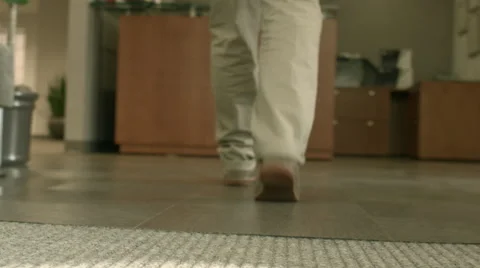 Man Walking into Office Lobby Stock Footage 61236514