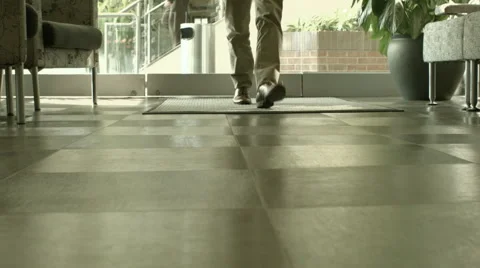 Man Walking into Office Lobby Stock Footage 61236826