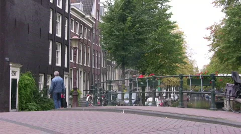 Man walking in old Amsterdam Stock Footage 108262