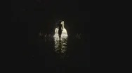 Man Walking Out Of A Cave Stock Footage