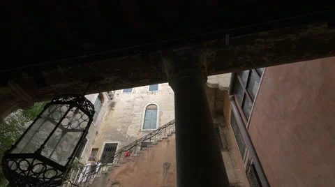 Man walking on an outside staircase located in an interior courtyard, Venice Video stock 58997789