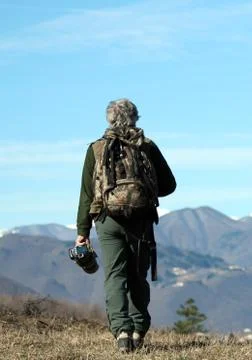 Man walking over the mountains Stock Photos