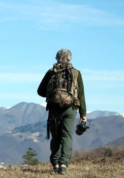 Man walking over the mountains Stock Photos