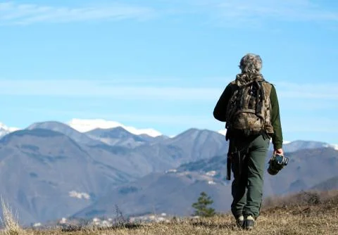 Man walking over the mountains Stock Photos