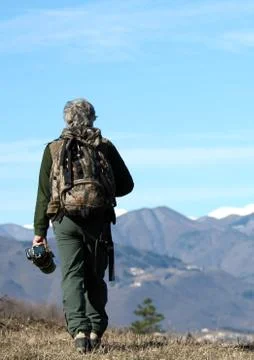 Man walking over the mountains Stock Photos