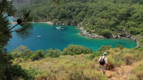 The man is walking on the path along the Lycian Way. Hike among the beautiful Stock Footage 221165916