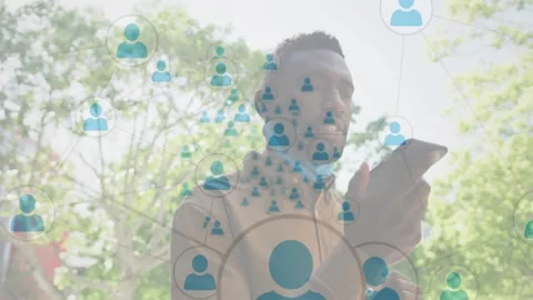 Man walking path tapping phone, activating growing tech overlay around torso Stock Footage 331084958