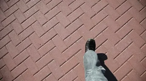 Man Walking on pavement Stock Footage 12656640