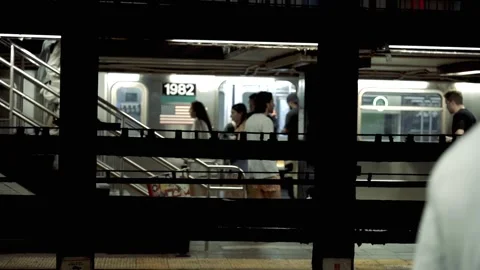 Man walking, people getting on subway Union Square Station Manhattan NYC 4K Stock Footage 255754486