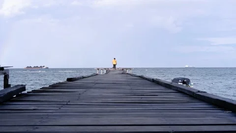 Man walking on the pier Stock Footage 223767663
