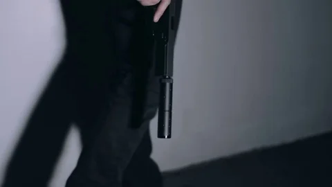 Man Walking with Pistol Stock Footage 74909301