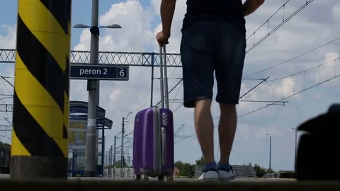 Man walking on the platform and drinking water on very hot day Stock Footage 78651902