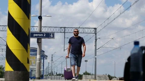 Man walking on the platform and looks irritated while waiting for train Stock Footage 78652171