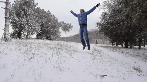 The man walking, playing and having fun in the first snow in winter. Stock Footage 72237142