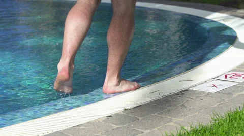 Man walking by the pool HD Stock Footage 23722053