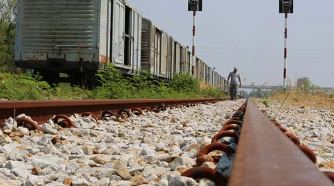 Man walking on railroad Stock Footage 46668036