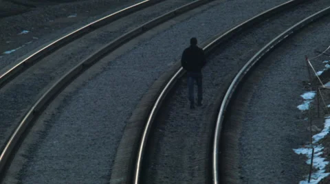 Man walking on the railroad Stock Footage 48597543