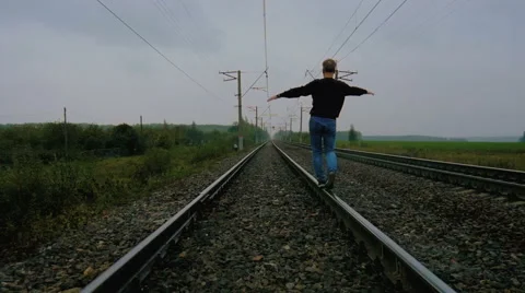 Man walking on the railroad Video stock 67793140