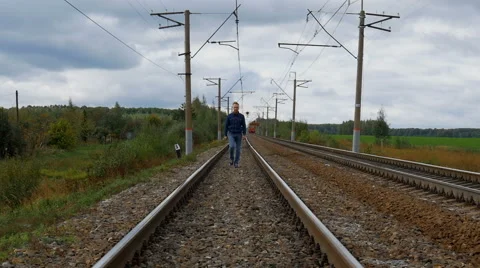Man walking on the railroad Video stock 67811679