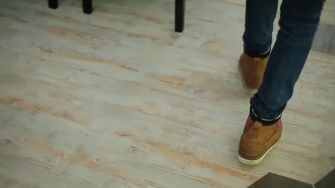 Man walking on the restaurant view of the legs Stock Footage 71655923