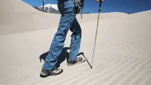 Man Walking up Rippled Sand Backpacking in Sand Dunes National Park Video stock 106073090