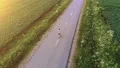 The man walking on the road on the sunset background. quadrocopter shot 4k or 4k+ Resolution