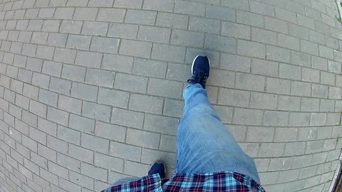 Man walking on the road. Top view of legs. gopro Video stock 91587332