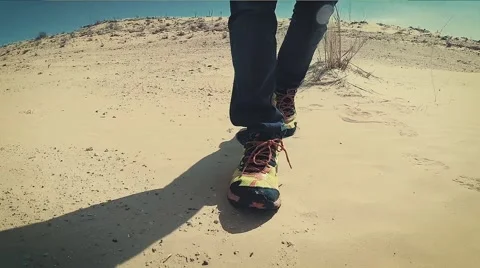 Man Walking on a Sahara Desert Dune close up Stock Footage 64256155