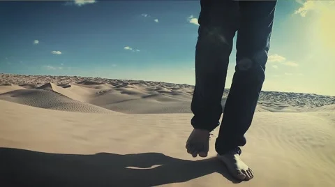 Man Walking on a Sahara Desert Dune close up Stock Footage