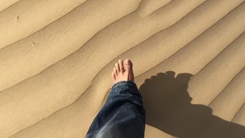 Man walking on the sand Stock-Footage 74691130