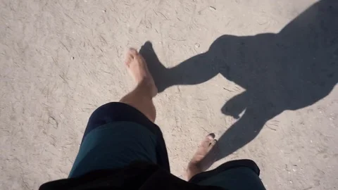Man walking on sand Stock Footage 103075763