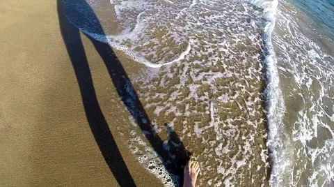 Man walking on the sandy beach, slow motion Stock Footage 47794414