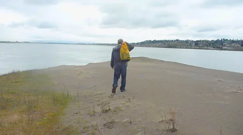 Man Walking on Sandy Path 1 Stock Footage 2595934