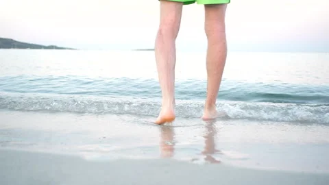 Man walking into the sea Stock Footage 247901491