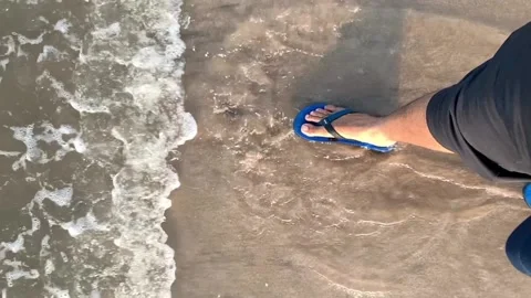 A man walking on sea waves. Slow-Motion Stock Footage 132990797