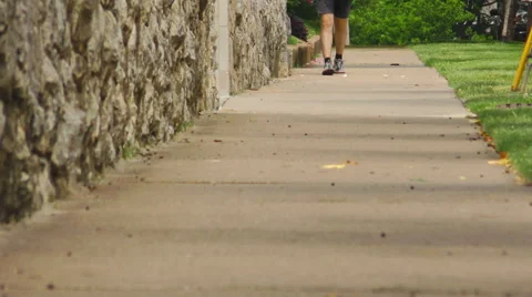 A Man Walking on a Sidewalk Stock Footage 50035305