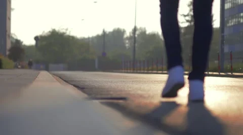Man walking on the sidewalk. Sunset time. Stock Footage 63555288