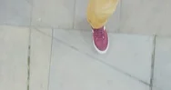 Man Walking On Sidewalk Wearing Colorful Shoes Strolling Casual In City Top View Stock Footage